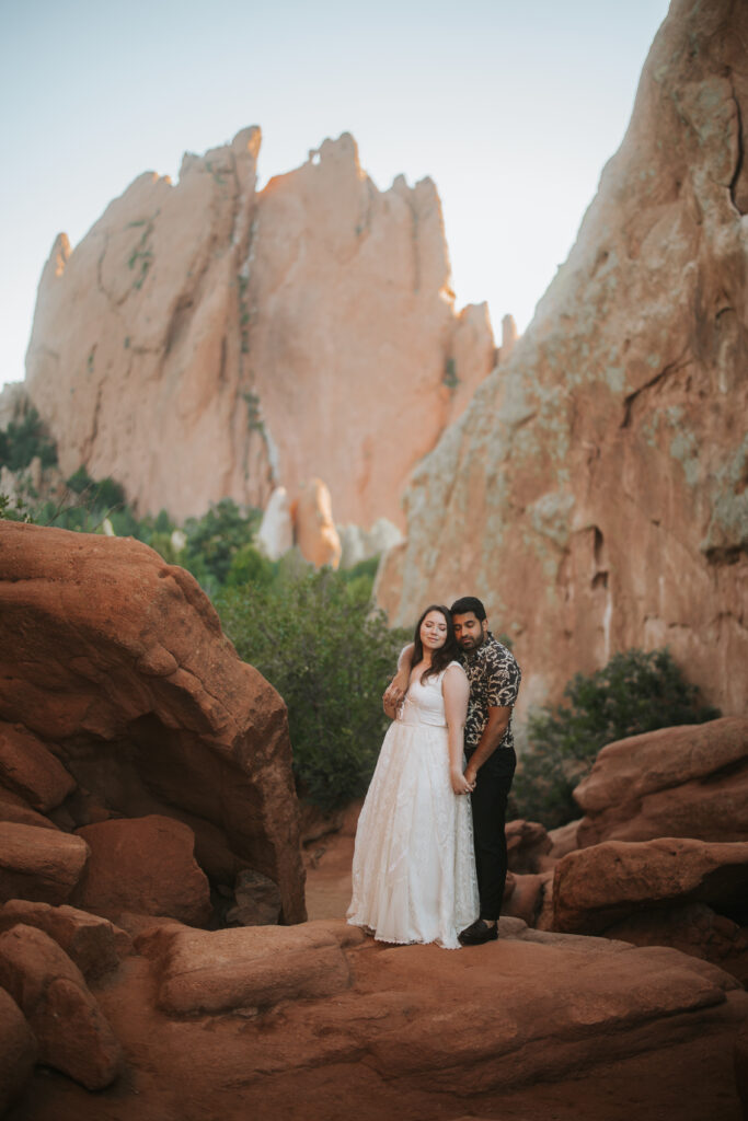Couple holding hands and taking a quiet moment on their Colorado elopement day at Garden of the Gods.