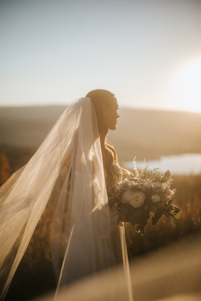 Bride looking out into the sunset at her Colorado elopement.