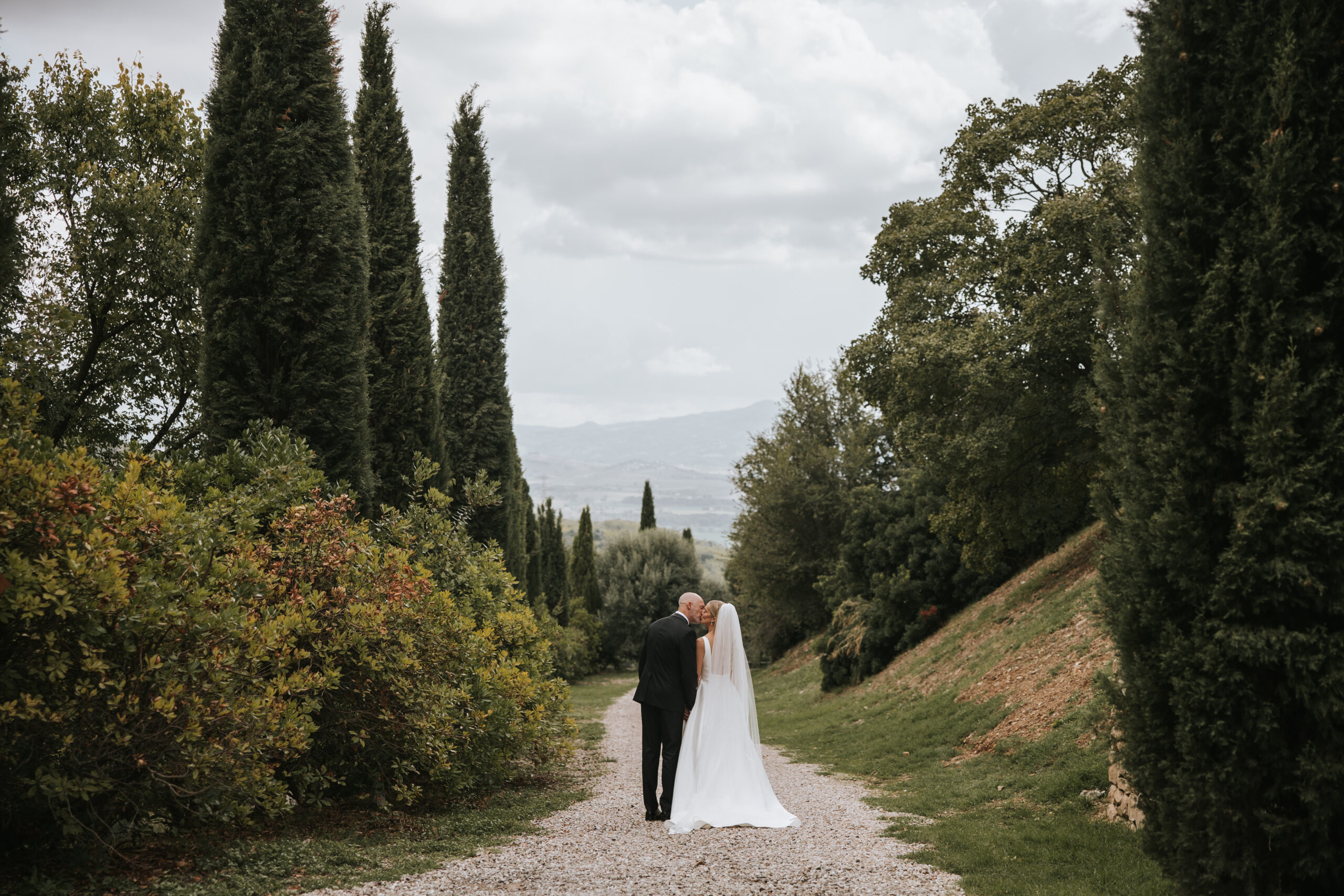 Beautiful outdoor wedding setup at a Tuscany villa with rolling hills in the background.